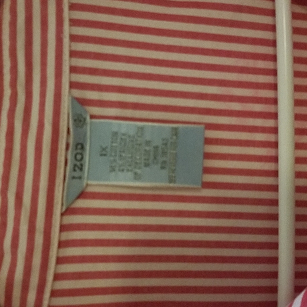 This gorgeous white and pink pin strap blouse is like new.